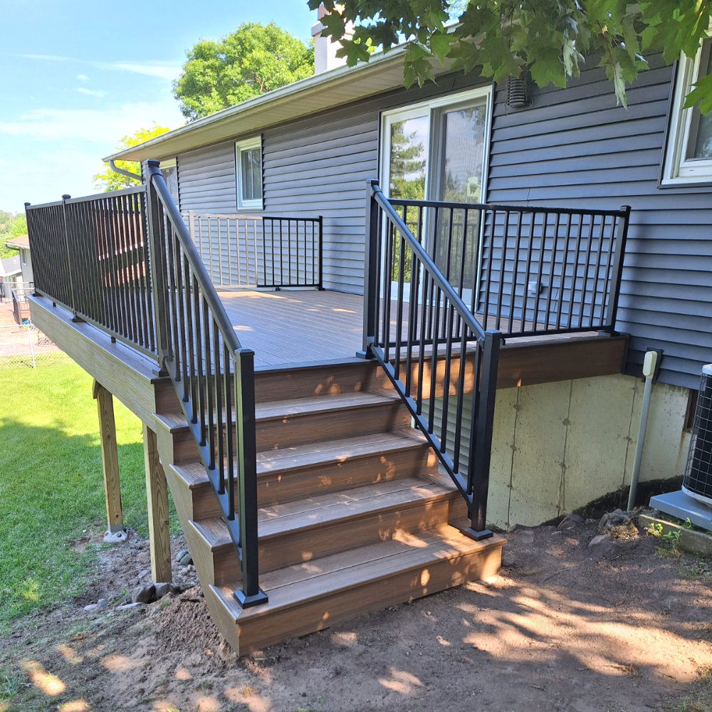 New composite deck build with metal railing picture frame design in Altoona Wisconsin